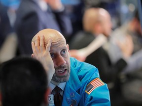 Traders work on the floor of the New York Stock Exchange shortly before the closing bell as the market takes a significant dip in New York, U.S., February 25, 2020.