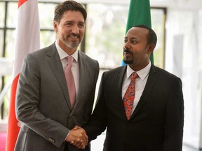 Canadian Prime Minister Justin Trudeau, left, is welcomed by Ethiopia's Prime Minister Abiy Ahmed before a meeting in Addis Ababa, on Feb. 8, 2020, as part of his official visit to Ethiopia ahead of the 33rd African Union (AU) Summit.
