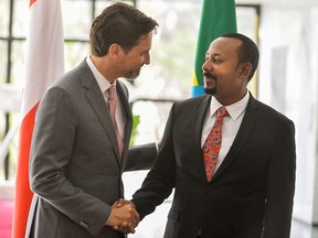 Prime Minister Justin Trudeau, left, is welcomed by Ethiopia's Prime Minister Abiy Ahmed before a meeting in Addis Ababa, on February 8, 2020.