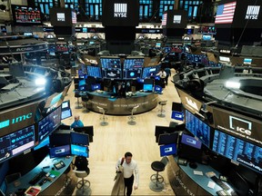 The floor of the New York Stock Exchange — seen here virtually empty after traders were sent home to work last week — appears as forlorn as some traders' accounts.