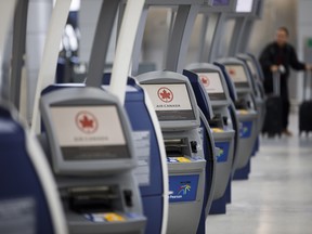 Air Canada check in terminals stand at Toronto Pearson International Airport (YYZ) in Toronto, Ontario, Canada, on Monday, March 16, 2020.