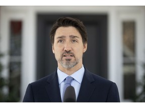 Prime Minister Justin Trudeau speak to the media during a news conference about the COVID-19 virus outside Rideau Cottage in Ottawa, Wednesday March 18, 2020.