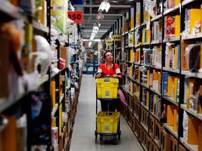Amazon.com Inc. is prioritizing the stocking and shipping of household staples and medical supplies as it struggles to deal with a surge in demand for online orders.
