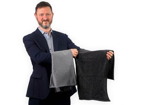 PPSS Group's CEO showcasing first production sample of his firm's black Cut-Tex PRO cut resistant fabric