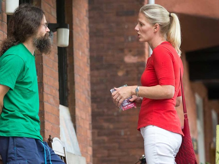  Liberal candidate for Ottawa Centre, Catherine McKenna, chats with an Ottawa resident on his doorstep during the 2015 campaign.