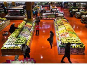 People shop for fresh produce in Toronto on Thursday, May 3, 2018. Statistics Canada says the consumer price index in February rose 2.2 per cent compared with a year ago.