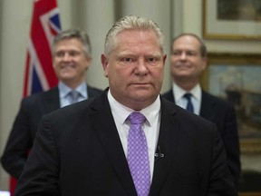 Ontario Premier Doug Ford, with Finance Minister Rod Phillips at left.
