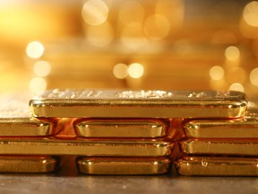 One kilogram fine gold bars sit stacked in the precious metals vault at Pro Aurum KG in Munich, Germany, on Wednesday, July 10, 2019. Gold rose for a third day after the Federal Reserve indicated that it’s preparing to cut interest rates for the first time in a decade as the global economy slows. Photographer:  ORG XMIT: 775370781