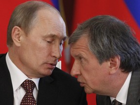 Rosneft President and Chairman of the Management Board Igor Sechin (R) with Russia's President Vladimir Putin.
