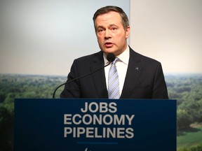 Alberta Premier Jason Kenney speaks in Calgary on March 31, 2020 about the the plan to kick-start construction on the Keystone XL pipeline.