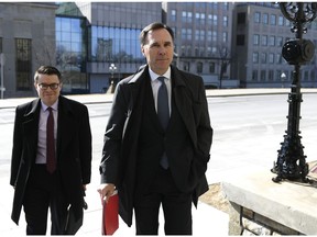 Minister of Finance Bill Morneau arrives for a press conference on economic support for Canadians impacted by COVID-19, at West Block on Parliament Hill in Ottawa, on Wednesday, March 18, 2020. The federal government's planned wage subsidy for businesses hard-hit by COVID-19 is being panned this morning by a voice for thousands of small businesses and a major union.TTHE CANADIAN PRESS/Justin Tang