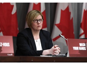 Minister of Employment, Workforce Development and Disability Inclusion Carla Qualtrough listens during a press conference on COVID-19 at West Block on Parliament Hill in Ottawa, on Wednesday, March 25, 2020.
