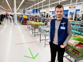Michael Gill, Walmart Canada Senior Manager Store Innovation, stands near staggered tape lines at the company’s Stockyards Toronto location.