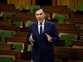 Minister of Finance Bill Morneau speaks in the House of Commons as legislators convene to give the government power to inject billions of dollars in emergency cash to help individuals and businesses through the economic crunch caused by the novel coronavirus outbreak, on Parliament Hill in Ottawa, March 25, 2020.