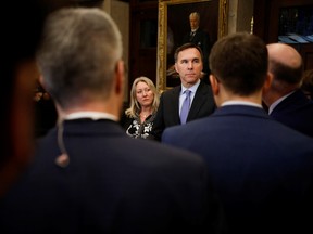 Minister of Finance Bill Morneau and Minister of Middle Class Prosperity Mona Fortier in the House of Commons foyer on Parliament Hill in Ottawa.