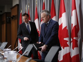 Bill Morneau, minister of finance, left, and Stephen Poloz, governor of the Bank of Canada, at a news conference in Ottawa on Wednesday.