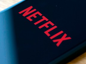 The Netflix logo on a phone.