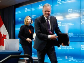 Stephen Poloz, governor of the Bank of Canada, and Carolyn Wilkins, senior deputy governor at the Bank of Canada, left, leave following a press conference in Ottawa.