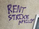 Rent strike graffiti spray painted on a building in Edmonton.