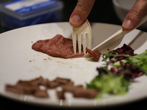 CEO and Founder of Novameat Giuseppe Scionti, 33, cuts a 3D printed vegan beef steak cooked for students to eat at the Culinary School of Barcelona, Spain February 25, 2020.