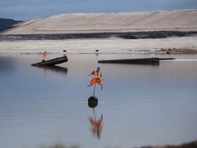Scarecrows at a Syncrude tailings pond in Alberta.