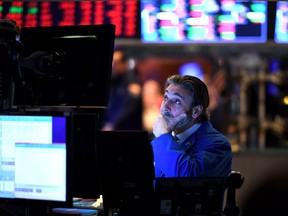 A trader reacts during the opening bell at the New York Stock Exchange (NYSE) on February 28, 2020.