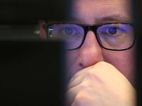 A stock trader looks at his screen during a trading session at Frankfurt's stock exchange.