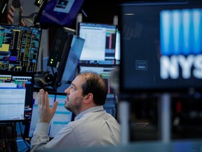 A trader works on the floor of the New York Stock Exchange on Friday, March 20.