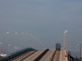 A truck transports a shipping container on a service road at Barcelona commercial port in Barcelona, Spain, on Friday, March 23, 2020.