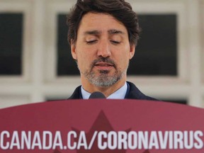 Prime Minister Justin Trudeau speaks to news media outside his home in Ottawa, Ontario.