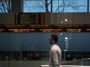 A passerby inside the building that houses the Toronto Stock Exchange.