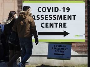 Torontonians come and go from a Covid-19 Assessment Centre at the Michael Garron Hospital in East York on Sunday March 15, 2020.