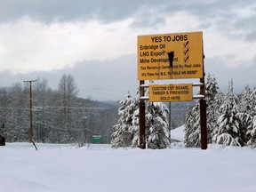 Pro oil and LNG export signage is seen along Highway 16 near Telkwa, B.C., on Thursday, January 10, 2019.