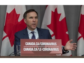 Minister of Finance Bill Morneau responds to a question during a news conference in Ottawa, Friday, March 27, 2020.