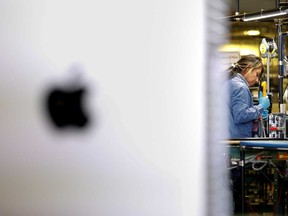 Flextronics International Apple factory employees work on Apple Mac Pro computer assembly in Austin, Texas.