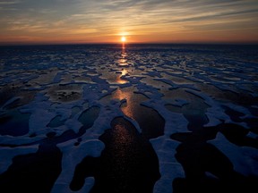 The midnight sun shines across sea ice along the Northwest Passage in the Canadian Arctic Archipelago, in July 2017.