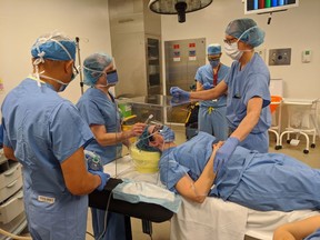 Physicians at Humber River Hospital in Toronto demonstrate use of new intubation boxes that provide extra line of defense during COVID-19. Klick Health helped with prototyping and is donating 300 boxes to city hospitals.