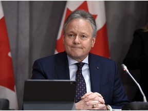 Governor of the Bank of Canada Stephen Poloz listens to a question at a press conference on Parliament Hill in Ottawa, on Wednesday, March 18, 2020. Canada's central bank will make an announcement today on its key interest rate and detail the impact of COVID-19 on the national economy.