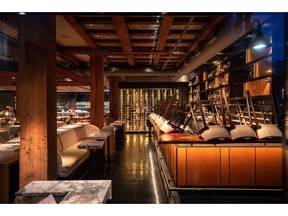 Chairs are turned upside down on the bar at a closed restaurant, amid concerns about the spread of the coronavirus, in Vancouver, on Tuesday, March 17, 2020. COVID-devastated bars and lounges as well as the country's hard-hit cannabis sector will have access to $40 billion in new credit being made available via the government's business bank, its CEO said on Sunday.