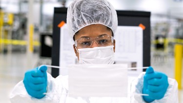 Workers begin final preparation for manufacturing Level 1 face masks Wednesday, April 1, 2019 at the General Motors facility in Warren, Michigan.