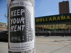 A sign publicizing a rent strike is fixed to a light pole in Toronto, on April 6.