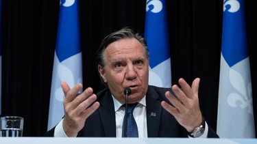 Quebec Premier Francois Legault responds to reporters during a news conference on the COVID-19 pandemic.