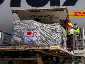 Medical supplies from China are unloaded from a Boeing 747-400F (LX-GCL) cargo aircraft at the Geneva Airport, Geneva, Switzerland.