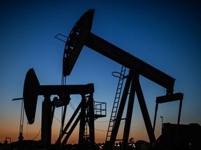 Oil pumpjacks at dusk in California.