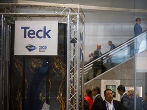 Attendees ride escalators past Teck Resources Ltd. signage during the Prospectors & Developers Association of Canada (PDAC) conference in Toronto, on March 2, 2020.