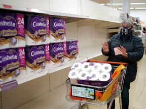 A shopper shows her surprise at the availability of toilet rolls at Sainsbury's Supermarket in Northwich, United Kingdom. Demand and supply are like gravity and are not going to change.