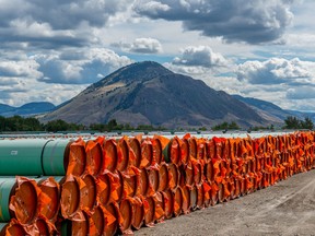 Steel pipe to be used in the oil pipeline construction of the Canadian government’s Trans Mountain Expansion Project lies at a stockpile site in Kamloops, British Columbia.