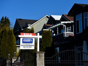 A "sold" sign is displayed outside a home in Vancouver, on Thursday, April 16, 2020.
