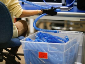 An employee works on assembly of VOCSN Multi-Function Ventilators, which integrate five separate medical devices, at Ventec Life Systems.