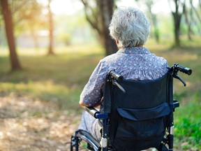 Asian senior or elderly old lady woman patient on wheelchair in park : healthy strong medical concept